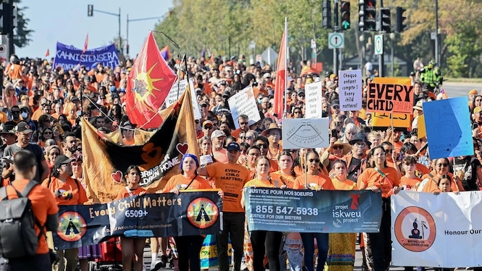 People take part in a march on National Day for Truth and Reconciliation in Montreal, Saturday, September 30, 2023. THE CANADIAN PRESS/Graham Hughes